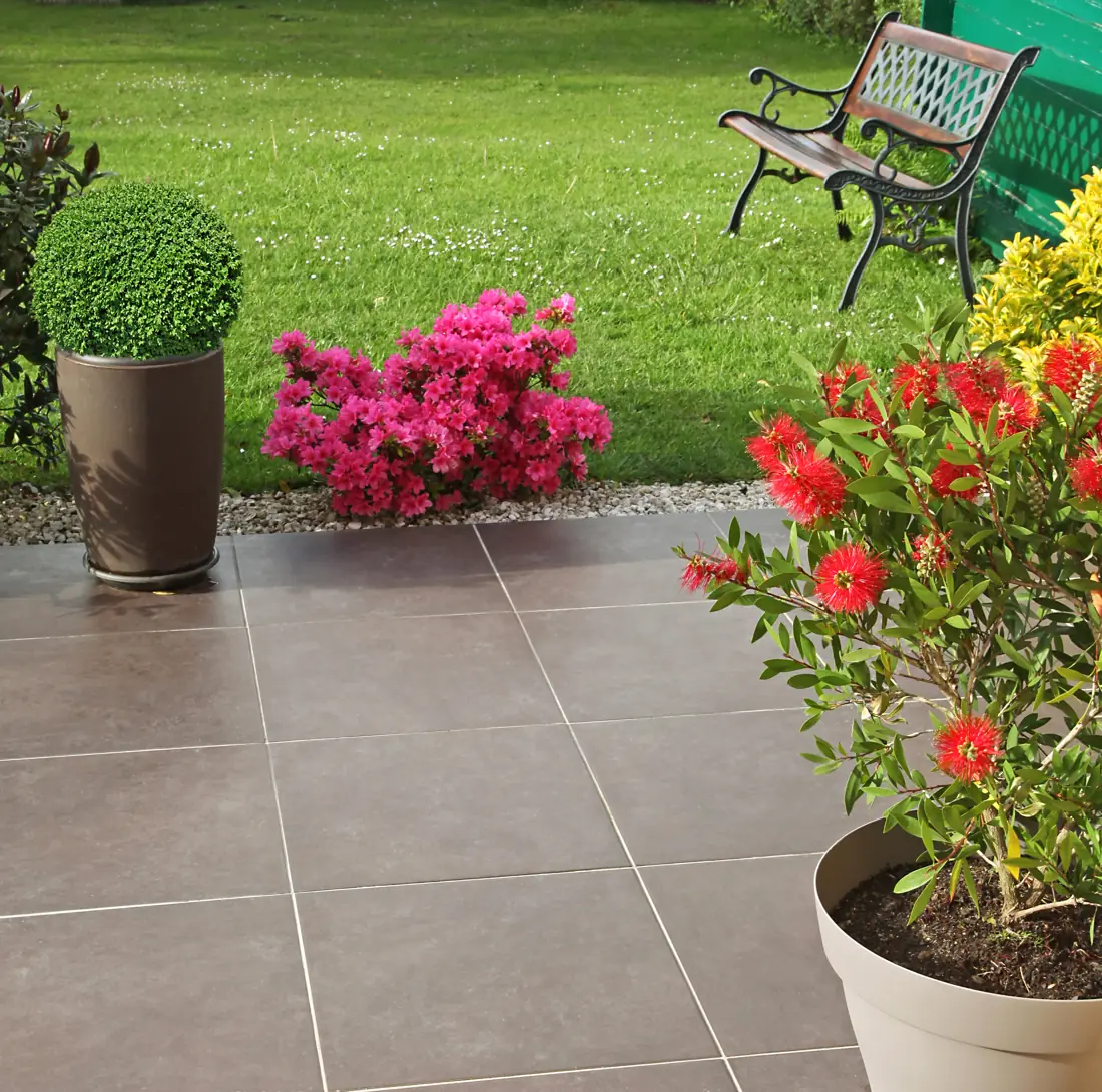 Patio with flowering azaleas and shrubs in pots